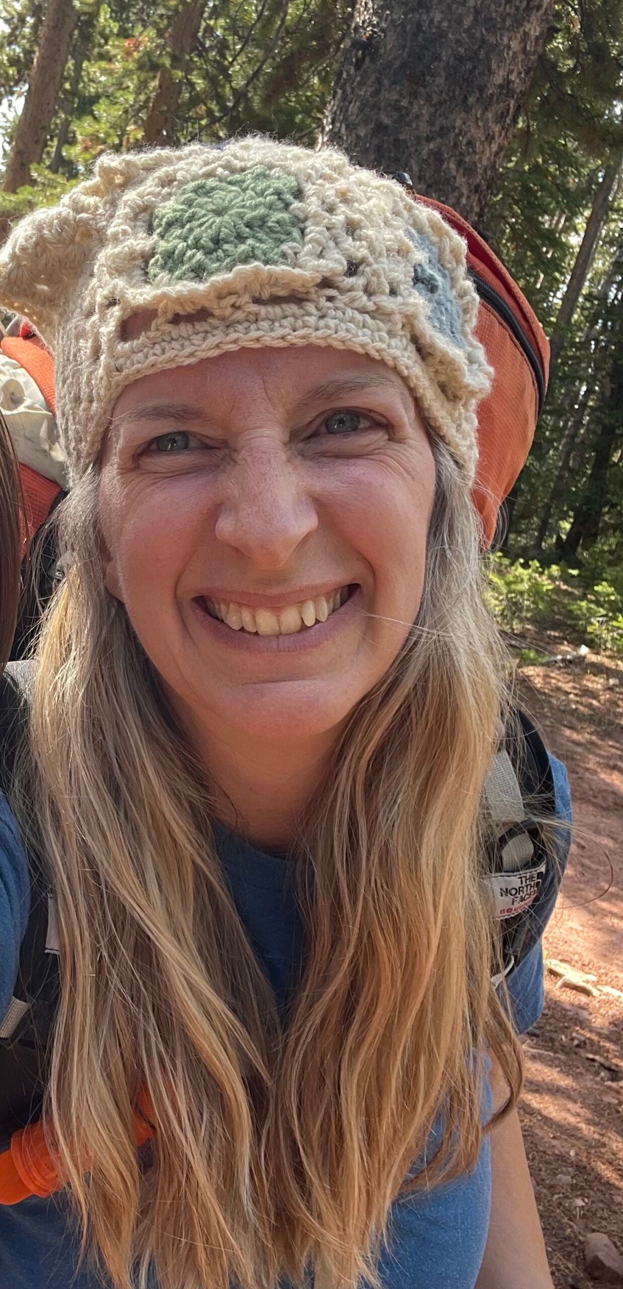 About She Hikes in the Basin author Lizzy wearing a crocheted bandana while hiking.